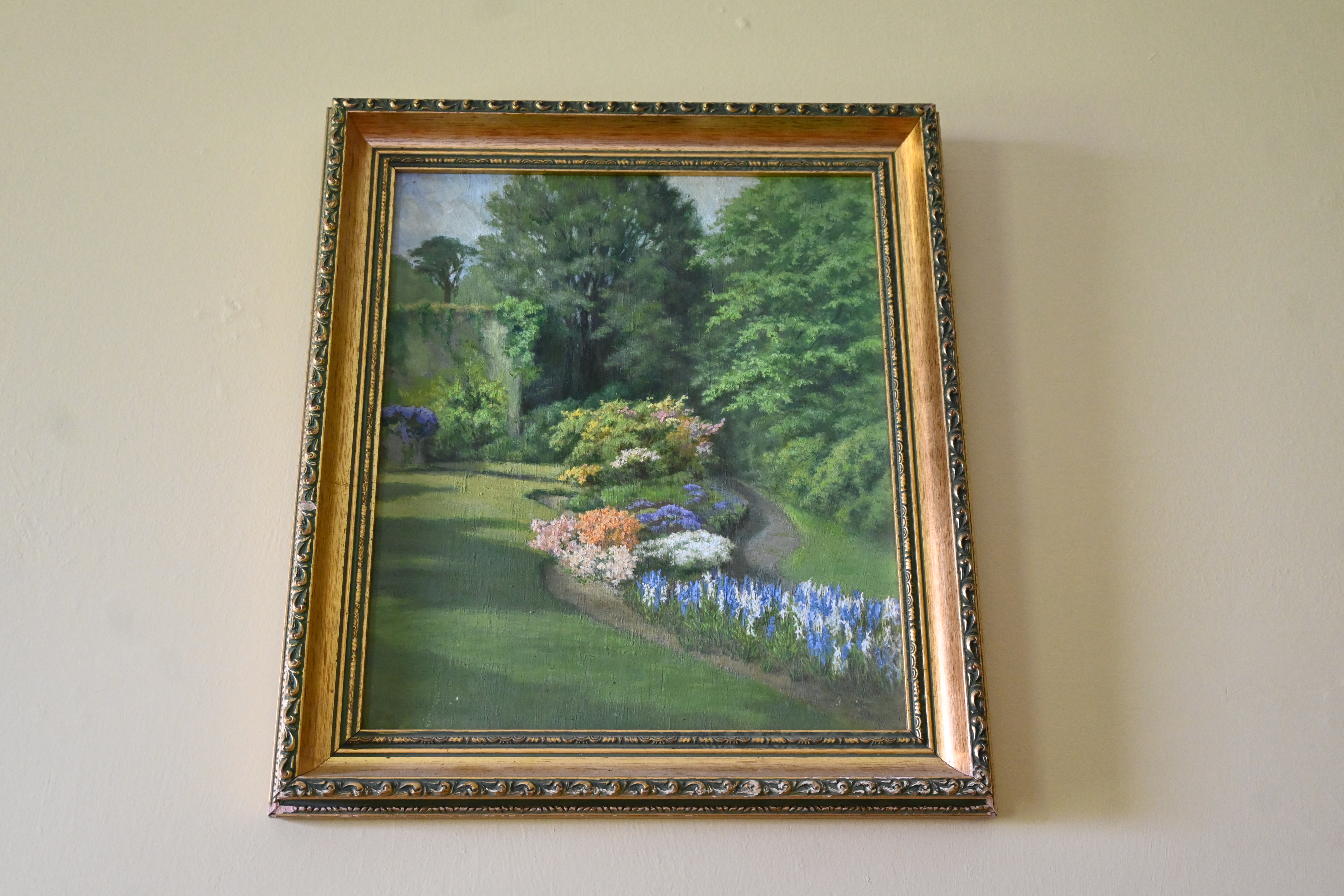 One of the items to be auctioned: Oil painting of garden with flower lined path 